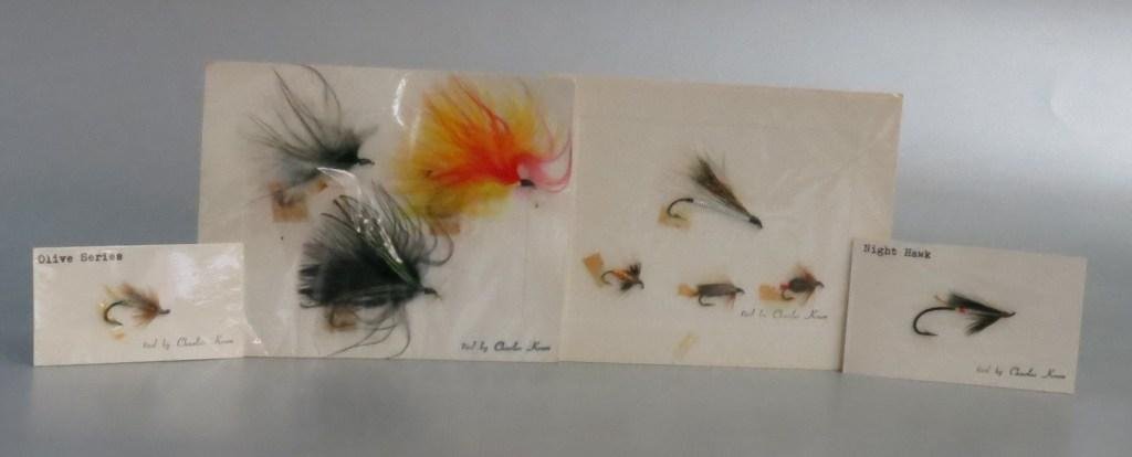Nine Charlie Krom Flies on Four Cards: All cards have the "tied by Charles Krom" stamp and are a mixture of trout and salmon flies. All affixed to the cards with tape. All are in Excellent condition.