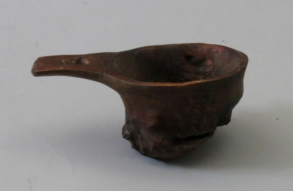 Burl Canoe Cup: Carved with a small handle, these were typically made by the guides of the "Sports" and presented after a successful trip. Especially after a good tip from the angler. Condition is Very Good.