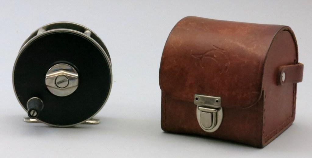 Hart Salmon Reel with Case: A machined reel with hard mat Teflon finish, anti- reverse and right hand wind with click in and silent out. The dimensions are 3 3/8" dia. & 1 1/4" spool width, reel is marked on the foot with U336 a