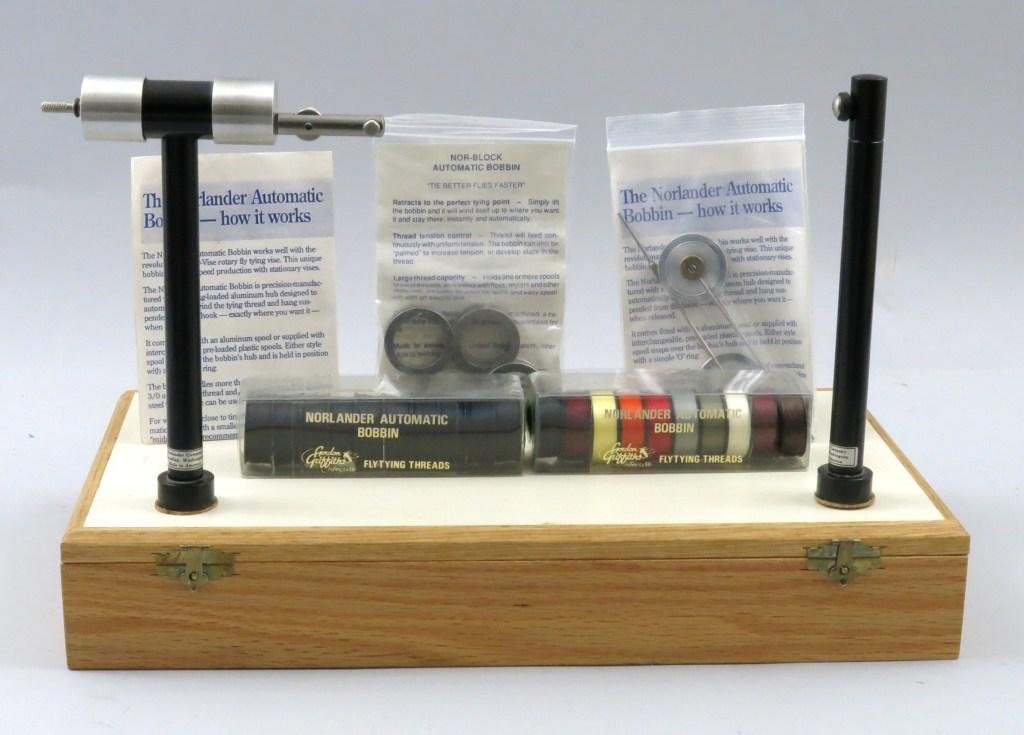Norlander Norvise Fly Tying Kit: Including the Norvise, 2 Automatic Bobbins, 4 spare spools, 10 multi-color spools of threads, 10 black spools of thread and the fly tying travel case/fly tying table. All are in Excellent condition wi