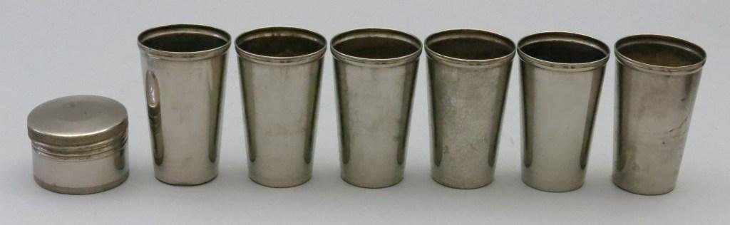 Six Nesting "Thermocups": All are marked "Thermocup Licensed Pat. No.1021716, March 26, 1912 - MF'D by American Thermos Bottle Co. New York". Each are 3 3/4" tall and assembled the unit stands at 5". A VG+ set with the bottom 