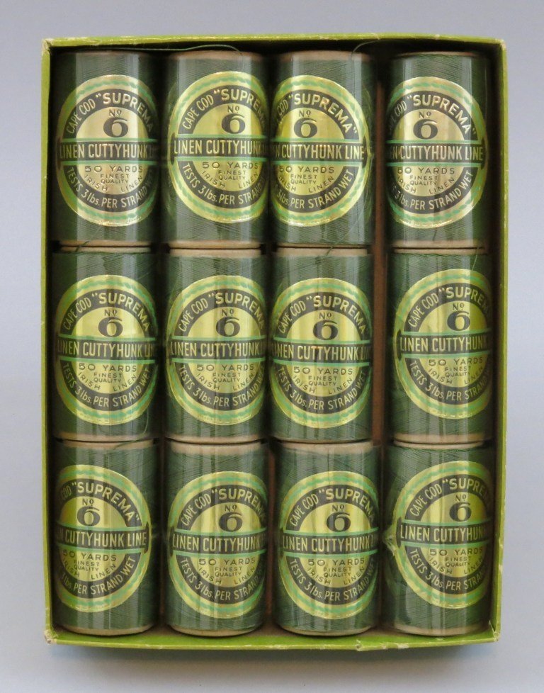 12 New Spools of Cape Cod "Suprema" Cuttyhunk Line: Supreme Quality Irish Linen Cuttyhunk Line No. 6 Green, 3 lb. test. 50 yd. per spool. All are unused and complete in labelled box. Some wear to box edges and partial edge chipping to box label.