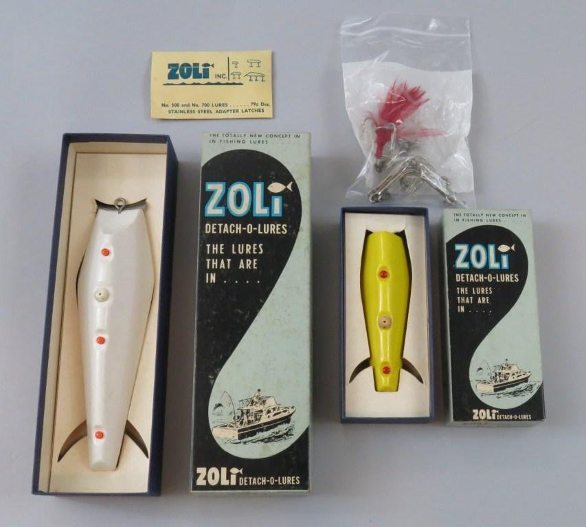 Pair of Zoli Lures, New in Box: This lot includes two Zoli lures, both new in correct boxes with correct detachable hooks. There is a large white 7" #700 and a smaller yellow 4 1/4" #500. Both baits and boxes are hardware store new.