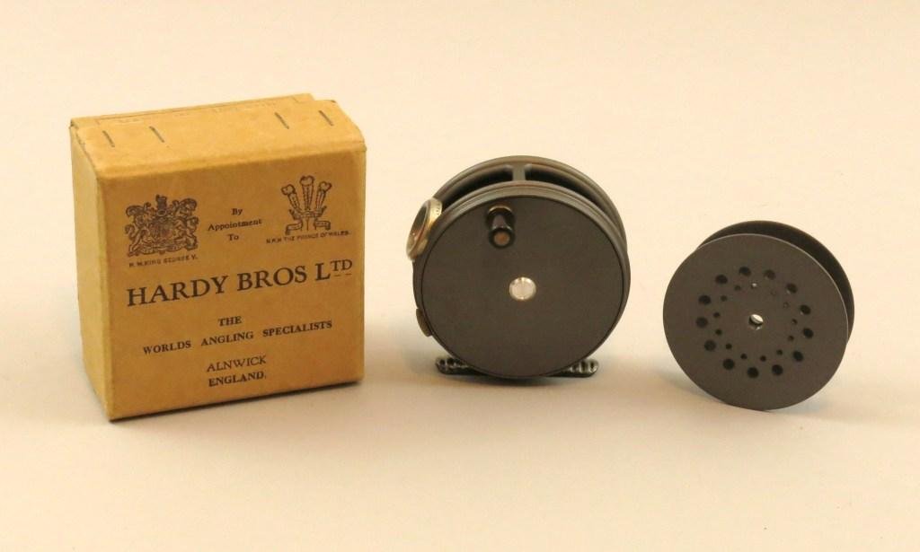 Hardy "Perfect" Trout Reel: A 3 1/8" English made RHW reel with an agate line guide set in a Hardy's Pat. Nickel silver ring, a Nickel silver rim tension screw, and ribbed alloy foot. Mint unused and comes with new extra spool a