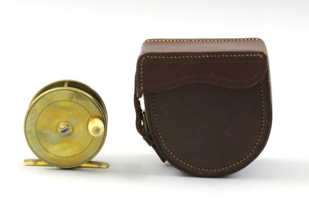Charles Farlow Brass Trout Reel: A 2 3/4" dia. and 1" wide English trout reel with makers mark inscription on tailplate; "C. Farlow & Co Ltd. 10. Charles St. St. James Sq. S.W. 191 Strand, W.C." This plate wind model was made between