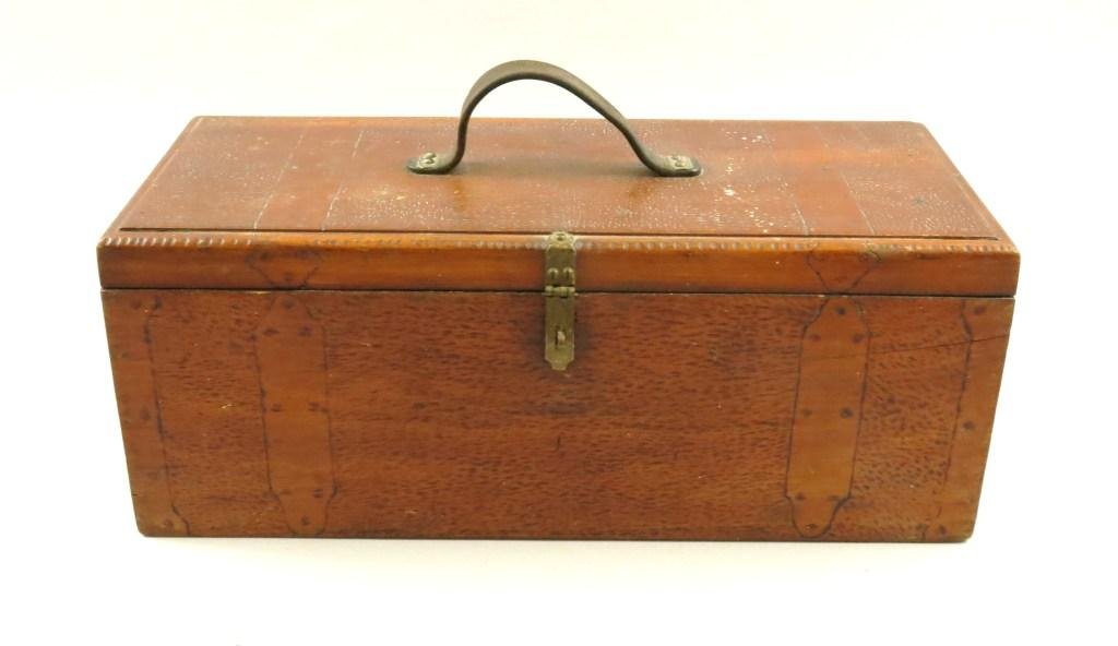 Elaborately Detailed Tackle Box: Measuring 18" X 8" X 6", this single sliding tray tackle box is accented with brass hardware and hand detailing throughout the exterior. Leather handle, lift strap and cork protective floor. The super