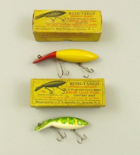 Pair of Rush Tango Swimming Minnows in Boxes: Includes a 4" E+ white, yellow & green mottled back bait in a lightly stained deep box with shallow top very faintly and correctly marked on the upper left hand front of the box. Also includes an E- 5