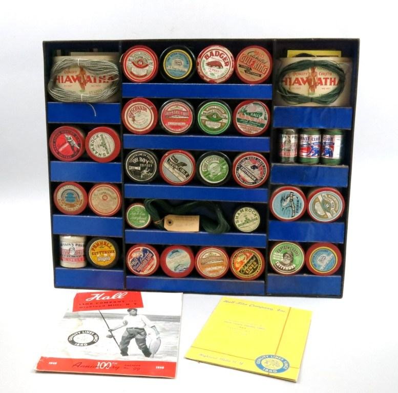 Hall's Fishing Line Display Box: A display of 27 labeled spools, 8 on cards and 5 others. Also about a half dozen uncut spool labels. Two Hall company catalogs, Nos. 97 and 99. All housed in a 19 3/4" x 23 1/4" display box with cover