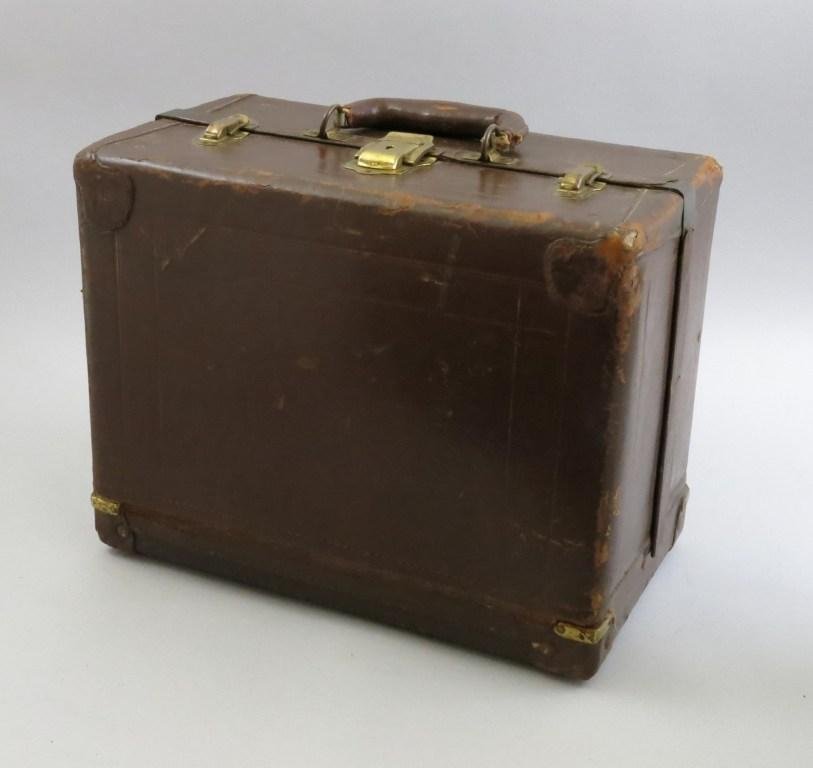 Sixteen Tray Knickerbocker Leather Tackle Box: Featuring sixteen trays, this 16 1/4" x 9 1/2" box stands 12 1/2" tall. Marked on the bottom "Knickerbocker Case Co. Chicago" this warrior of the water is adorned with brass hardware and leather handl