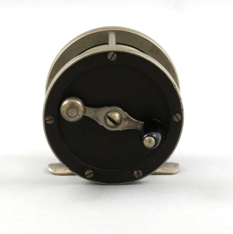 Pflueger 80 yd. Hawkeye German Silver Reel: Screw off end cap, sliding click switch and nickel silver protective rims over the hard rubber side plates in Good condition, no chips or cracks in the hard rubber, foot shows a small amount of filing