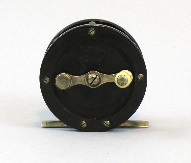 Small 2 3/8" Cozzone Hard Rubber 80 yd. Trout Reel: Good condition reel with strong click, rear mounted wear compensating bearing cap, and hard rubber side plates. Does have some surface scratches and nicks, spool has significant side play causing spoo