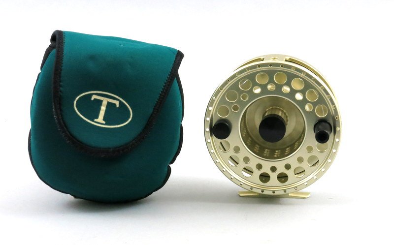 Tibor Reel by Ted Juracsik "The Gulfstream": Solid aluminum in satin gold finish, name plate engraved "Shadows Ghost", serial no.A881. Can be set for left or right hand retrieve, currently right.11 oz., 4 3/8" x 1 3/4" frame, holds 300 yds. 30 l