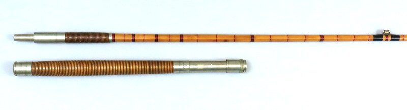 Edward vom Hofe Salt Water Rod 7' 3" 2 Piece: Sliding band reel seat, German silver fittings, full intermediate red wraps with black tipping at the guides, trumpet guides and rattan grip. Marked "Edward vom Hofe & Co. / Makers / N.Y." on butt cap