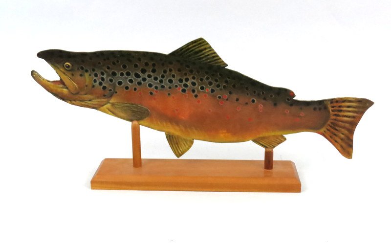 Thomas Aquinas Daly Painted Fish Cut-Out on Board: a 24" inch cut-out of a brown trout painted on board by noted sporting artist, Thomas Aquinas Daly. Originally sold at an Angler's Club of New York auction. Stands on a slotted base. Excellent conditi