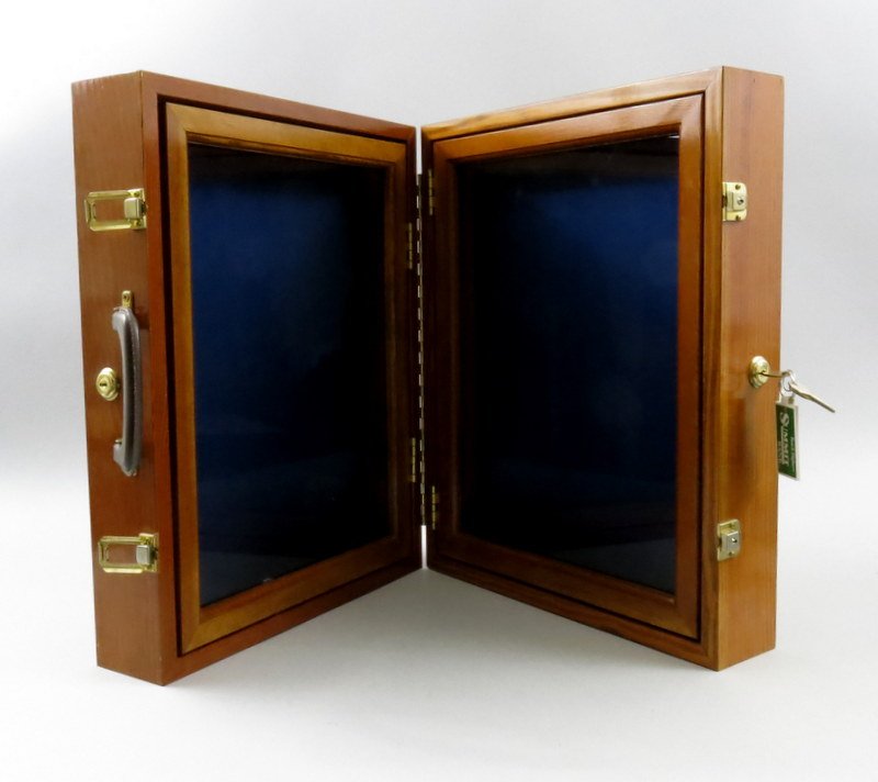 Polished Wooden Travel Display Case: Custom made display case measuring 16" x 20" x 7". Opens to two display cases that are 2 3/4" deep. An excellent item for displaying reels and lures. Brass hardware, leather handle and a lock for each
