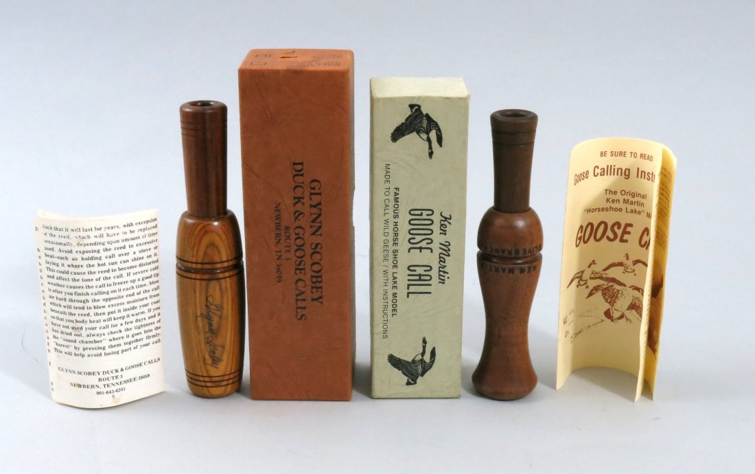 Ken Martin and Glynn Scobey Calls in Boxes: Ken Martin Goose call with paperwork and box, maker stamped on call. Glynn Scobey Goose call with paperwork and box, makers name signed on the call. Both in Excellent condition with only slight wear t
