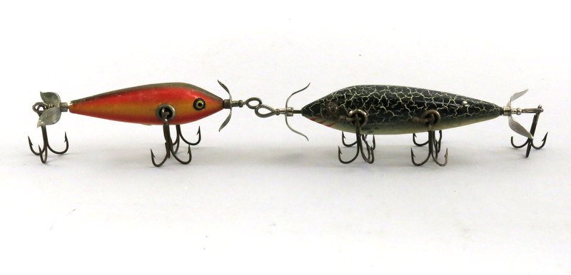 Pair of Heddon Underwater Minnows: Includes a three hook rainbow with cup rig, hand painted gill marks, marked props and perfect glass eyes in Very Good condition with general wear including varnish and paint flakes. Also includes a fi