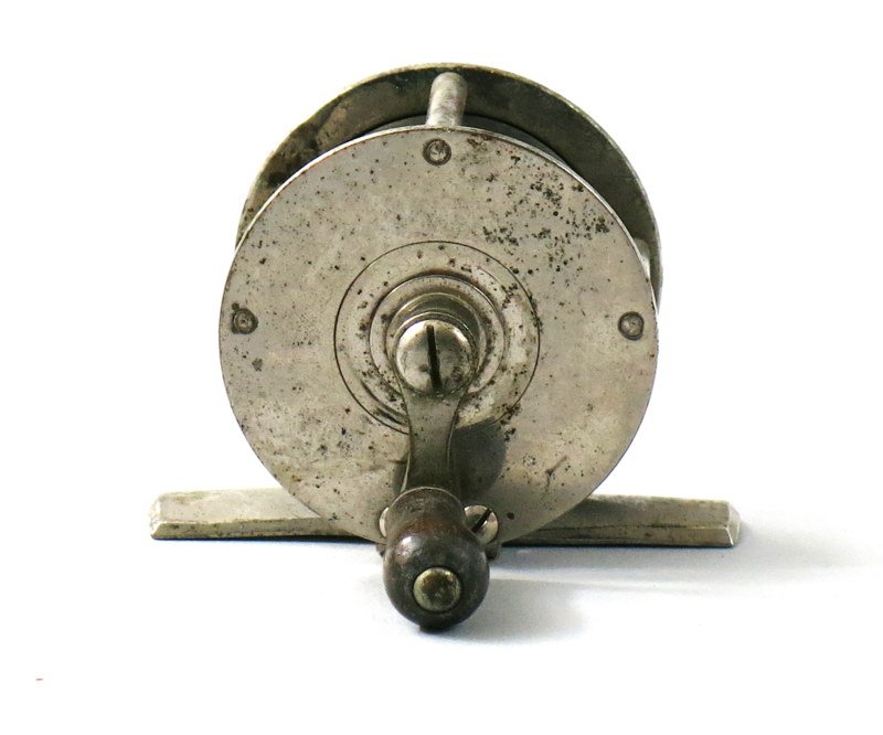 Silas Terry Date Stamped Crank Handle Trout Reel: Stamped on the foot "Pat. Nov. 14, 1871" identifying it as a Terry reel from the same makers of Terry clocks. This is an early 1 7/8" constant click, plated reel with corrosion and plating loss. Condi