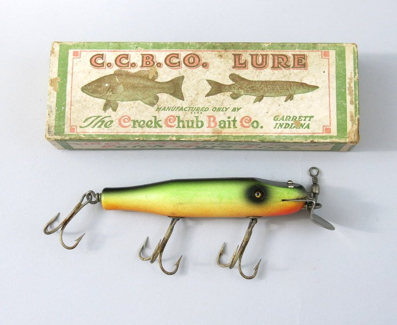 Creek Chub 3432 Fire Plug Snook Pikie in Correct Box: Fire Plug Snook Pikie coming in Excellent minus condition with hook tarnish some light age lines and light wear having perfect glass eyes in correctly marked Very Good end label box.