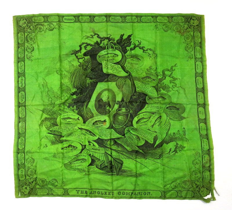 Large Early Twentieth Century Izaak Walton Silk Scarf: A 33" x 24" dark green scarf with Sir Izaak Walton as its focal point depicted within an elaborate, central cartouche. The illustrations as a whole are reminiscent of fine, copperplate engraving. Walt