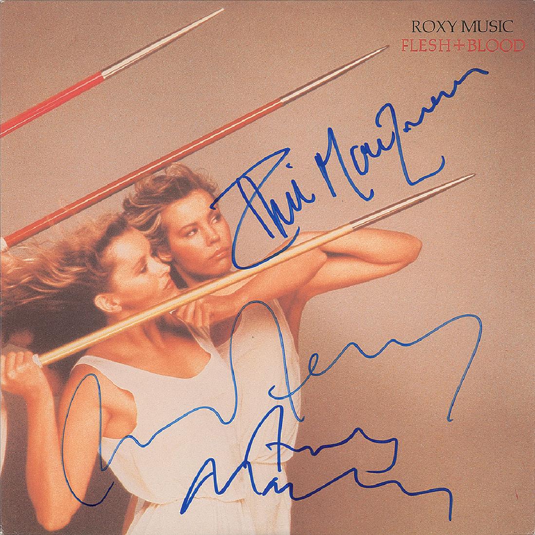 Roxy Music Signed Album: Flesh + Blood album signed on the front cover in blue felt tip by Bryan Ferry, Phil Manzanera, and Andy Mackay. In fine condition. The record is included.