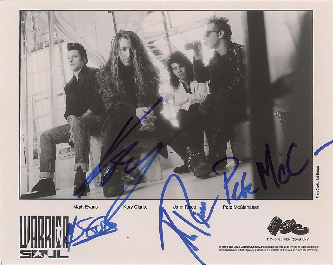 Warrior Soul Signed Photograph: Satin-finish 10 x 8 David Geffen publicity photo of the alternative metal band Warrior Soul, signed in blue felt tip by Mark Evans, Kory Clarke, John Ricco, and Pete McClanahan. In fine condition.
