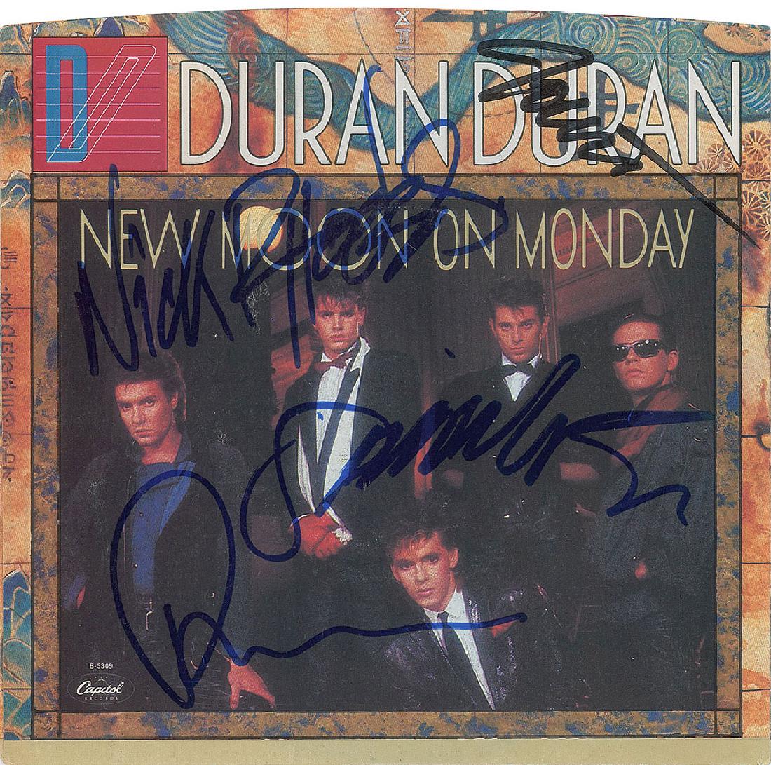 Duran Duran Signed 45 RPM Record: Capitol Records 45 RPM single record for 'New Moon on Monday / Tiger Tiger,' signed on the sleeve in blue by Simon Le Bon, Nick Rhodes, Roger Taylor, and in black felt tip by John Taylor. In fine cond