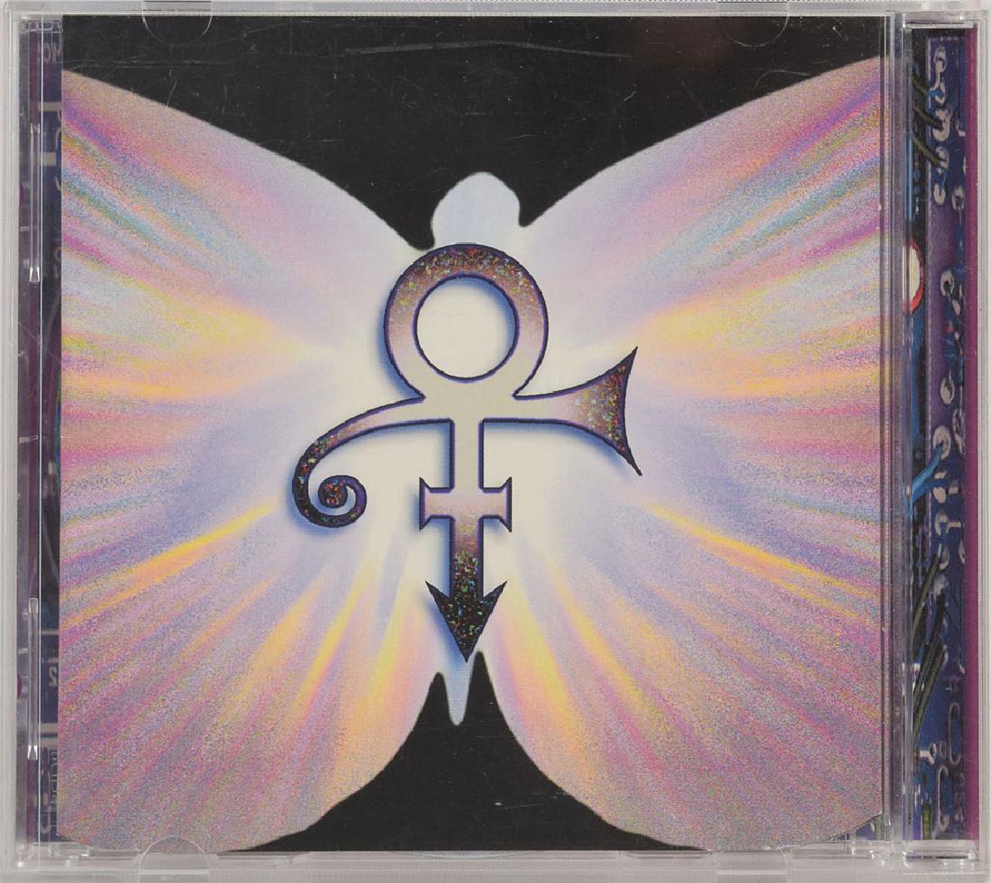 Prince Signed CD: The Beautiful Experience CD signed on the CD booklet centerfold in blue felt tip by Prince with his 'love symbol,' and signed inside on their respective pages in black felt tip by Morris Hayes, Tommy