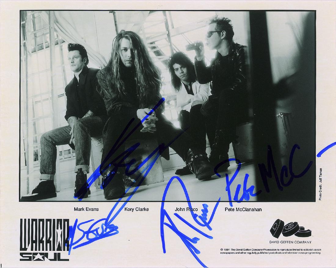 Warrior Soul Signed Photograph: Satin-finish 10 x 8 David Geffen publicity photo of the alternative metal band Warrior Soul, signed in blue felt tip by Mark Evans, Kory Clarke, John Ricco, and Pete McClanahan. In fine condition. Pro