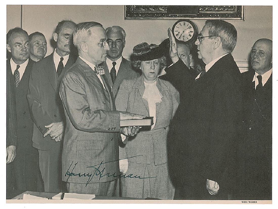 Harry S. Truman: Uncommon 8 x 6 book photo of Harry S. Truman being sworn in as the 33rd president of the United States on April 12, 1945, in the Cabinet Room at the White House, signed below in fountain pen. In fine