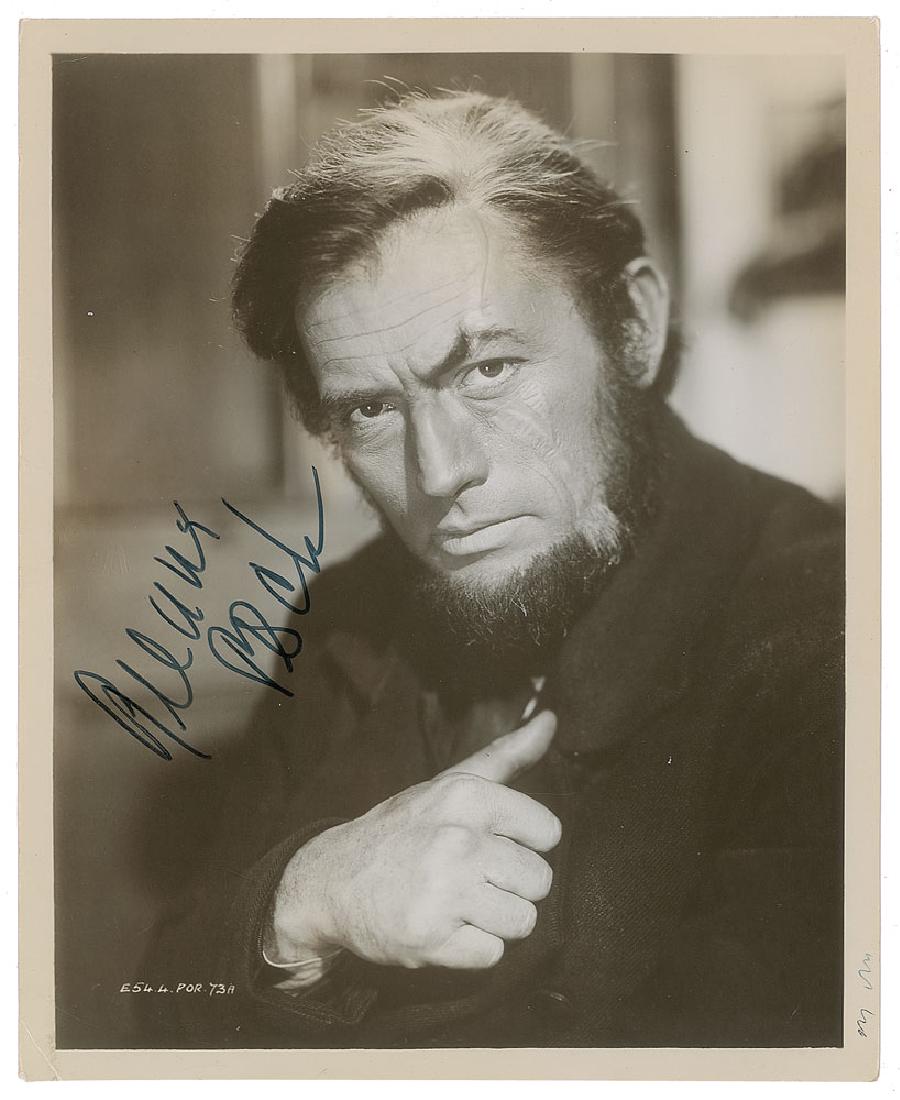 Gregory Peck: Sought-after glossy 8 x 10 photo of Gregory Peck as Captain Ahab from the 1956 film Moby Dick, signed in black felt tip. In very good to fine condition, with scattered light creasing, and a couple of