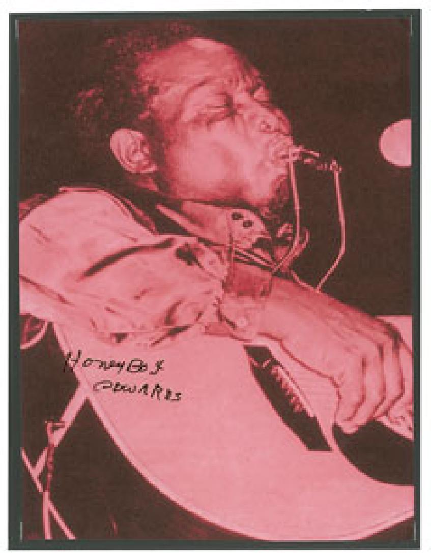 Honeyboy Edwards Signed Photograph: Delta blues guitarist and singer from Mississippi (1915–2011) who was closely associated with famed bluesmen Big Joe Williams and Robert Johnson. Red-tone semi-glossy 7.5 x 10 photo of Honeyboy Edwa