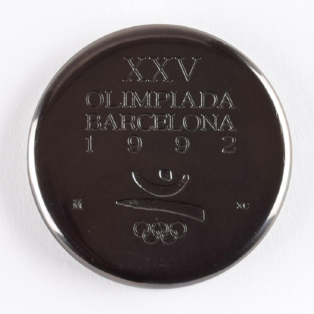 Barcelona 1992 Summer Olympics Participation Medal with: Participation medal issued for the 1992 Barcelona Summer Olympics. Burnished copper, 70 mm, 254 gm, by Xavier Corbero; manufactured by FÃ¡brica Nacional de Moneda y Timbre. The front is engraved "XX