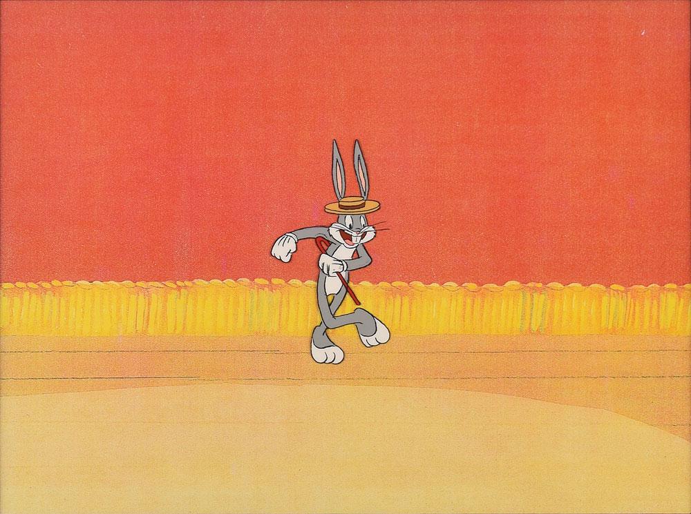 Bugs Bunny production cel from a Warner Bros. cartoon: (Warner Brothers Studios, 1990s) Original production cel featuring Bugs Bunny from a Warner Bros. cartoon, showing the iconic character dancing with a cane and top hat. The cel is placed on a color co