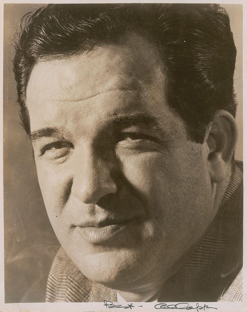 Al Capp: Glossy 7.75 x 10 close-up photo of the influential cartoonist, signed in the lower border in black ink, "Best—Al Capp." In very good to fine condition, with some small surface creases, and heavi