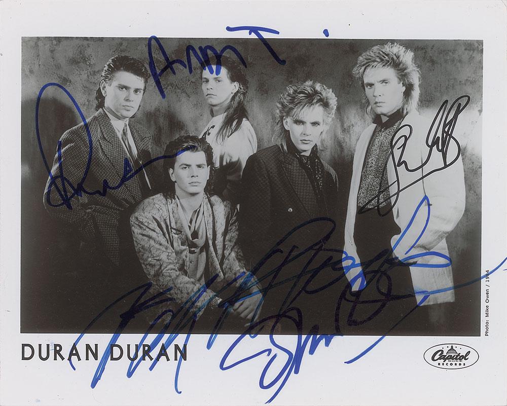 Duran Duran: Glossy 10 x 8 Capitol Records publicity photo of Duran Duran from 1984, signed in felt tip by Simon Le Bon, Nick Rhodes, Roger Taylor, John Taylor, and Andy Taylor. In fine condition.