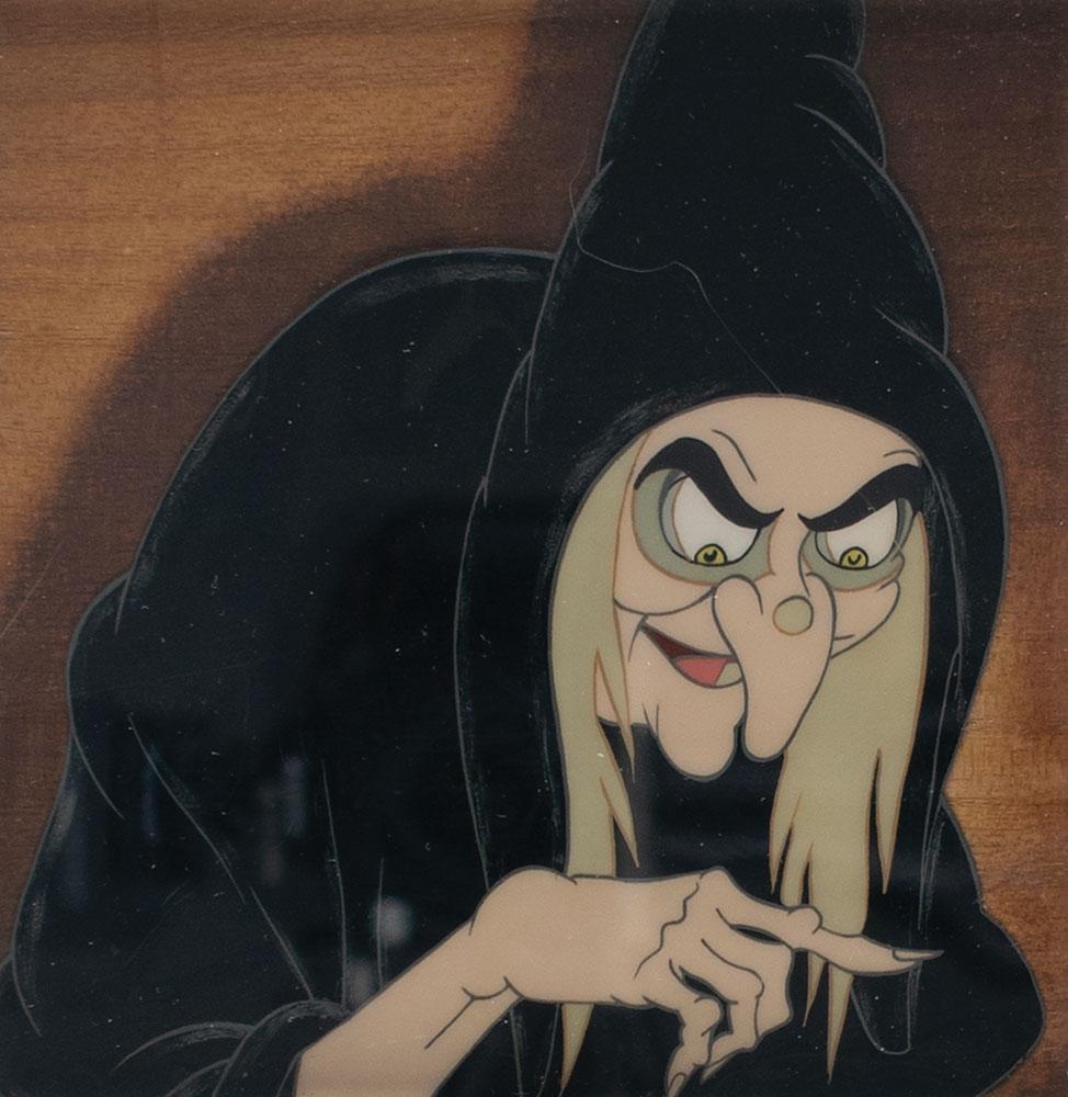 Wicked Witch production cel from Snow White and the: (Walt Disney Studios, 1937) Terrific original production cel of the Wicked Witch from Snow White and the Seven Dwarfs, portraying the evil character with a smirk and a bony outstretched finger. The ce