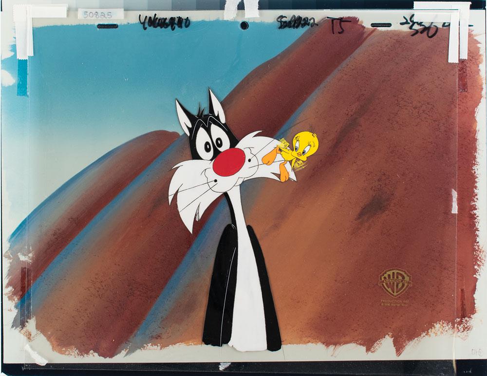 Sylvester the Cat and Tweety production cel from a: (Warner Brothers Studios, 1996) Original production cel featuring Sylvester the Cat and Tweety from a Warner Bros. cartoon, showing Tweety fluttering over Sylvester's whiskers. The cel is placed on a