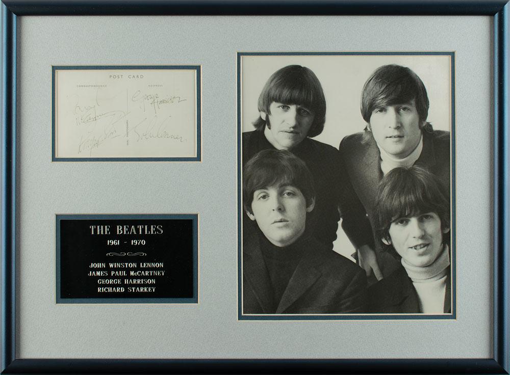 Beatles Signatures: Desirable framed display featuring vintage black ballpoint signatures of John Lennon, George Harrison, Paul McCartney, and Ringo Starr on the reverse of an off-white 5.25 x 3.25 postcard. Attractively