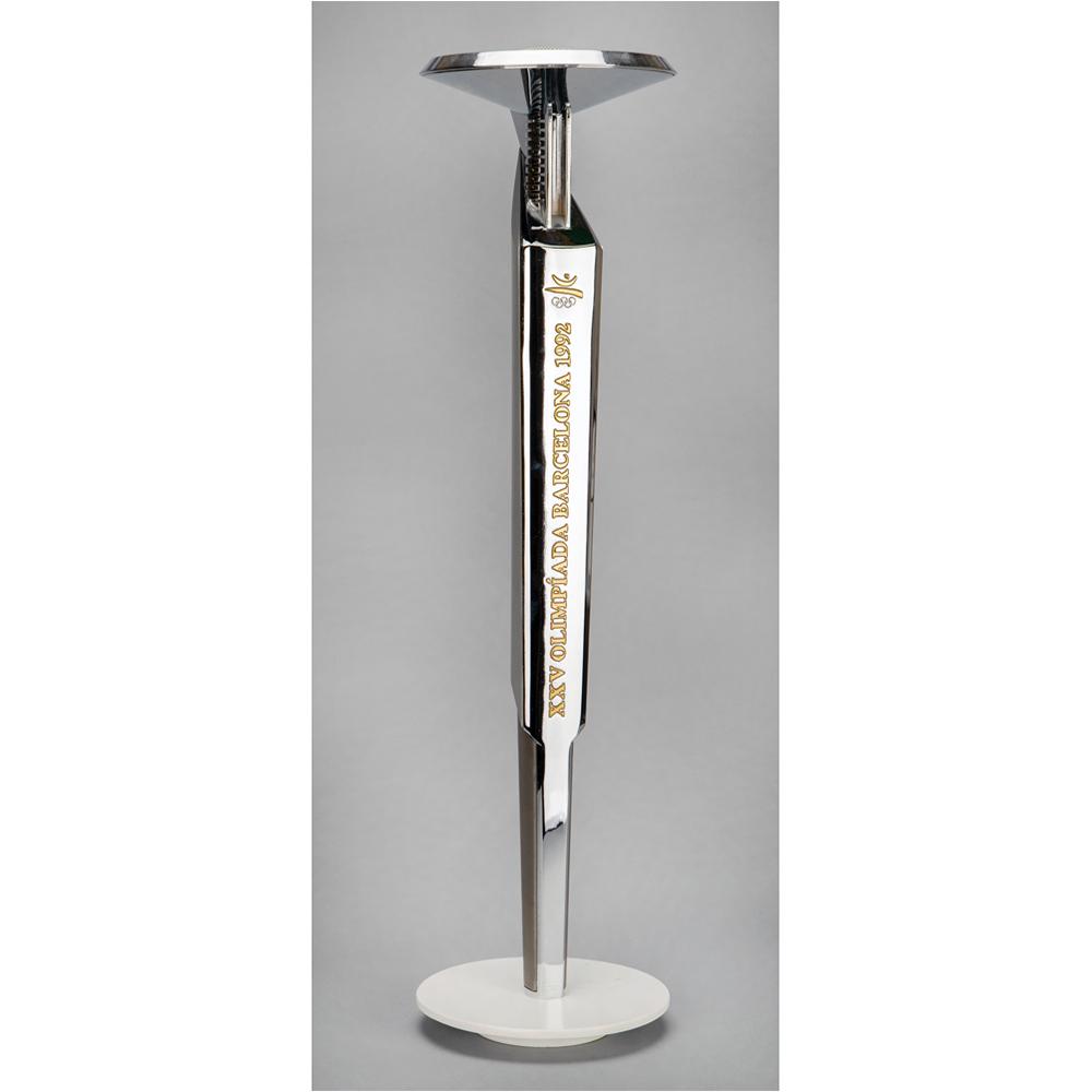 Barcelona 1992 Summer Olympics Torch: Official 1992 Barcelona Olympics torch, comprised of aluminum and plastic, measuring 26â€³ in length and 7â€³ at its widest point, designed by Andre Ricard. The metal body is inscribed in gold