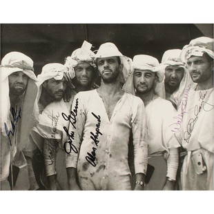 Mercury Astronauts (6) Signed Photograph: Excellent glossy 9.5 x 7.25 photo of the seven original Mercury astronauts during U.S. Air Force survival training exercises at Nevada's Stead Air Force Base in 1960, signed in black felt tip by