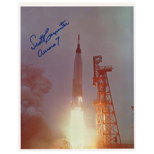 Scott Carpenter Signed Photograph: Color satin-finish 8 x 10 photo of the Mercury-Atlas 7 liftoff from Cape Canaveral, signed in blue felt tip, "Scott Carpenter, Aurora 7." In very fine condition.