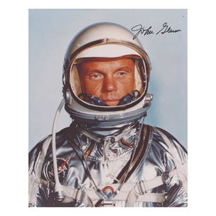 John Glenn Signed Photograph: Color semi-glossy 8 x 10 photo of John Glenn posing in his Mercury space suit, signed in black felt tip. In very fine condition.