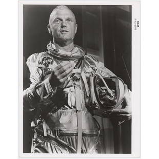 John Glenn Original 'Type 1' Photographs (2): Two official 'Type 1' glossy 8 x 10 black-numbered NASA photos (S-61-1878 and S-62-223), one showing John Glenn in his Mercury suit after an altitude simulation test, and the other showing him with