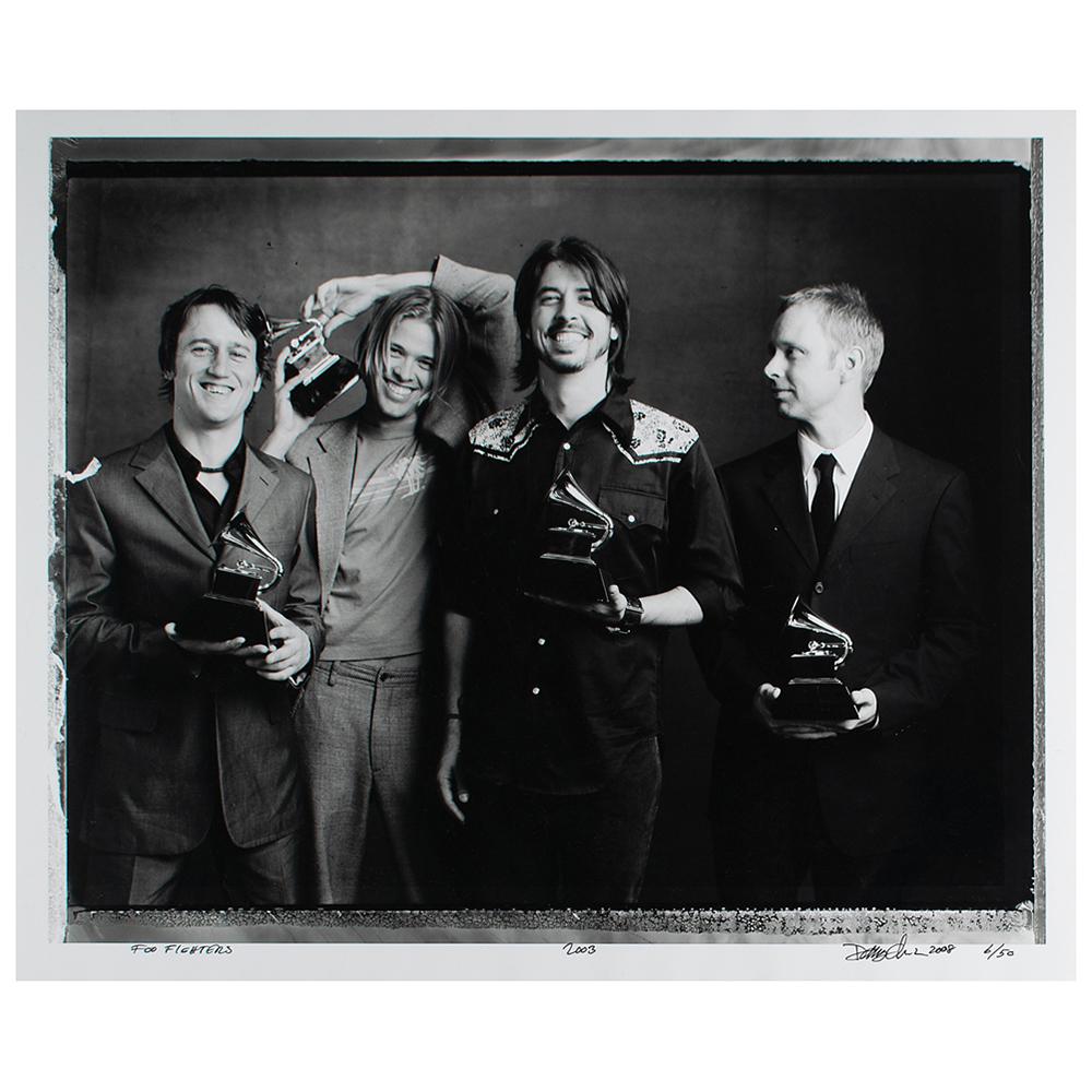 Foo Fighters Photograph by Danny Clinch: Limited edition glossy 24 x 20 silver gelatin photograph of the Foo Fighters posing with their Grammy Awards for 2003's Best Rock Album 'One By One,' numbered 6/50, titled and signed in the lower bord