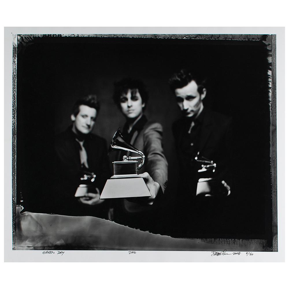 Green Day Photograph by Danny Clinch: Limited edition glossy 24 x 20 silver gelatin photograph of Green Day posing with their Grammy Awards for 2006's Record of the Year 'Boulevard of Broken Dreams,' numbered 4/50, titled and signed in th