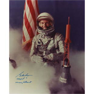 Gordon Cooper Signed Photograph: Color semi-glossy 8 x 10 photo of Cooper wearing his Mercury space suit next to a capsule model and surrounded by mist, signed in thin blue felt tip, "Gordon Cooper, Original 7, Mercury Astronaut."