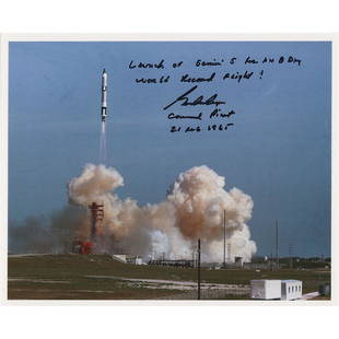 Gordon Cooper Signed Photograph: Color satin-finish 10 x 8 photo of the Gemini SC5 liftoff at Cape Canaveral, signed in black felt tip, "Launch of Gemini 5 for an 8 day world record flight! Gordon Cooper, Command Pilot, 21 Aug