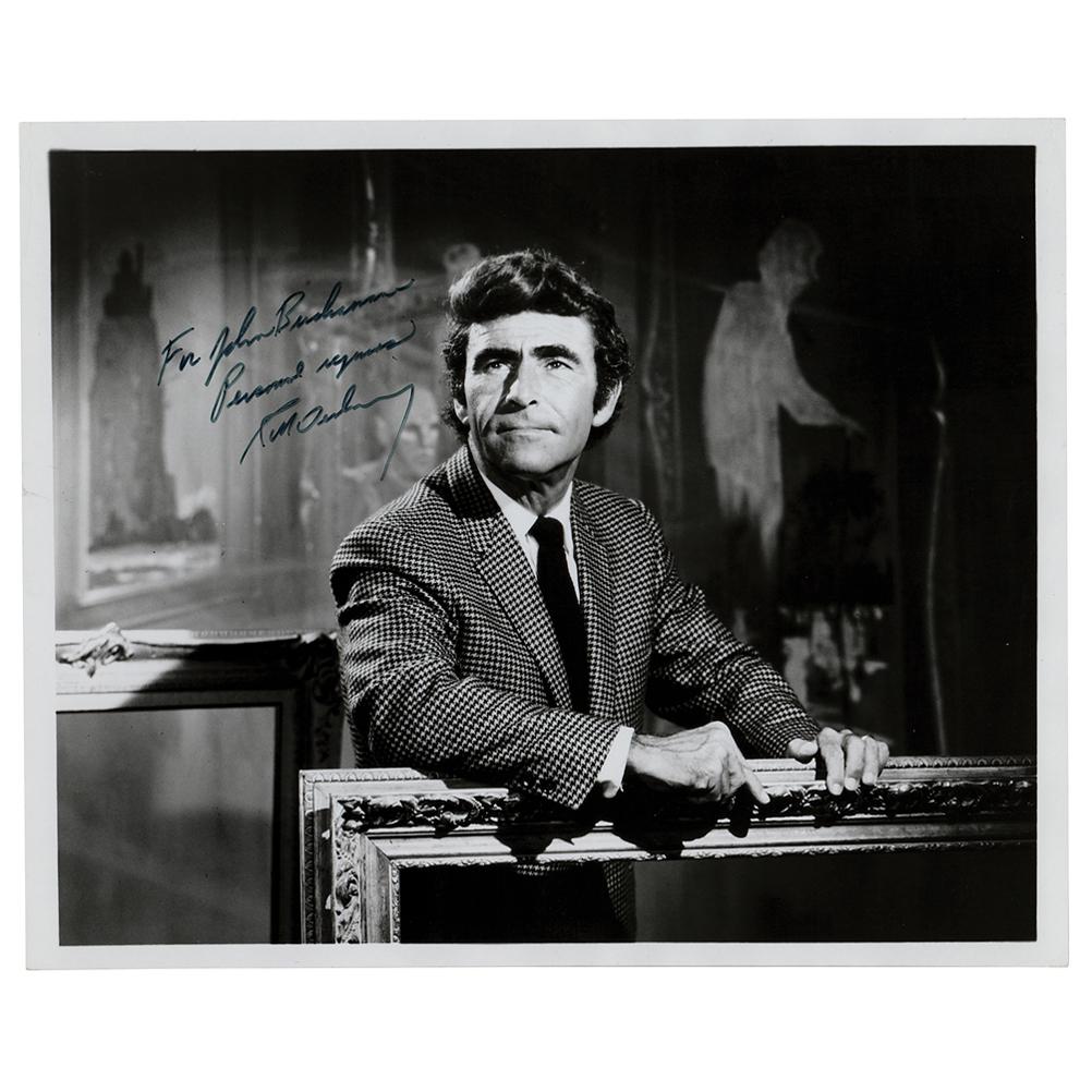 Rod Serling Signed Photograph: Glossy 10 x 8 half-length photo of Serling holding a large picture frame on the set of The Twilight Zone, signed and inscribed in black felt tip, "For John Bushman, Personal regards, Rod Serling.â