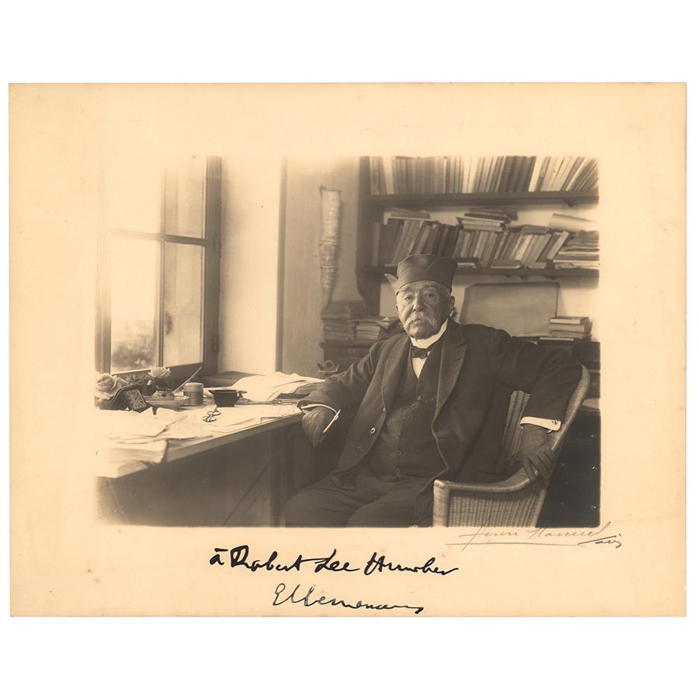 Georges Clemenceau Signed Photograph: Scarce matte-finish 11.5 x 9 photo of Clemenceau in his office by Henri Manuel, signed and inscribed in the lower border in fountain pen, "A Robert Lee Humber, G. Clemenceau.” Also signed in pen